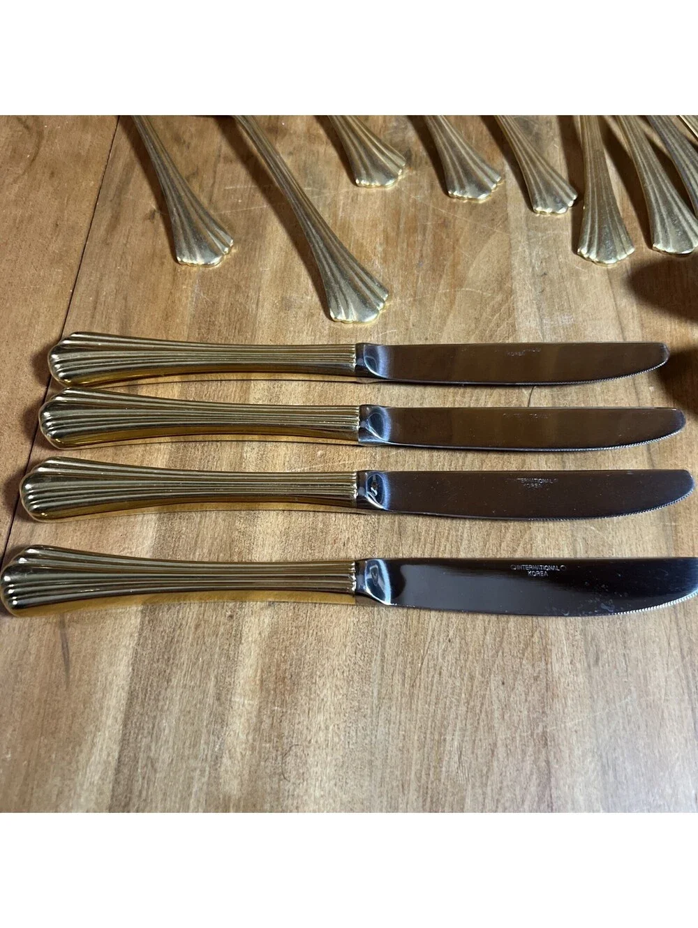International Stainless Golden Flair Place Setting For 4 + Serving Pieces